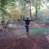 Happy forager skipping in the forest