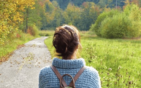 Woman appreciating the view of woodland during Forage London wild walk