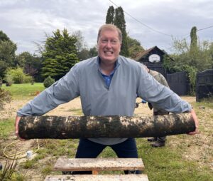 Man holding large log