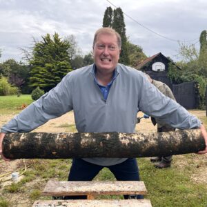 Man holding large log